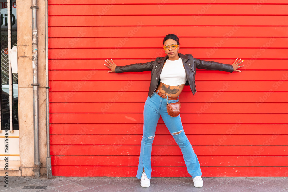 urban girl on the street with red wall background urban girl on the street with red wall background
