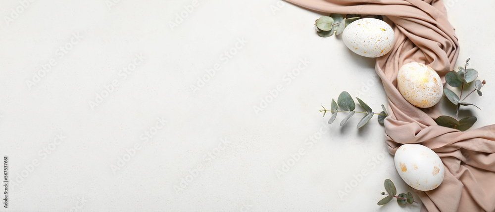 Beautiful Easter eggs, eucalyptus branches and cloth on light background with space for text - obrazy, fototapety, plakaty 