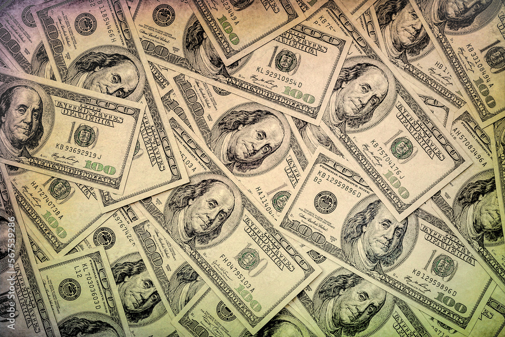 One hundred dollars. Money supply. US dollars banknotes background. Hundred dollar bills. American currency. Concept of money and finance. Toned image One hundred dollars. Money supply. US dollars banknotes background. Hundred dollar bills. American currency. Concept of money and finance. Toned image
