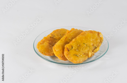 fried tempe on a plate with white background