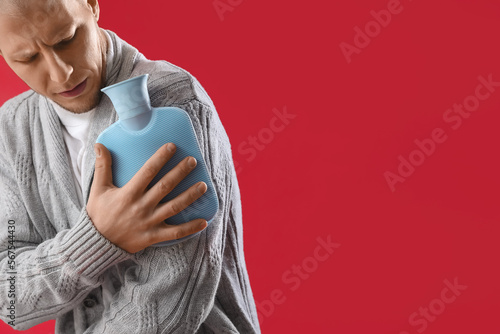Young man warming his arm w...
