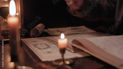 18th century ships captain writing in the log book