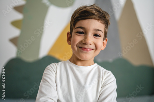 One boy caucasian child six years old kid in his room at home portrait