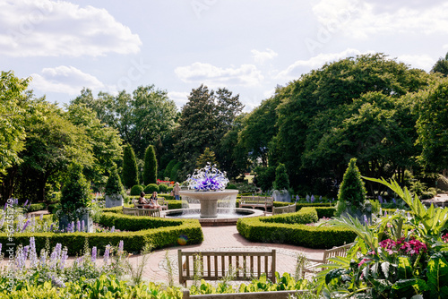 Atlanta botanical garden. Beautiful summer sunny landscape with trees and bushes and fountain in center of composition. 17 May 2021, Atlanta, Georgia, USA
