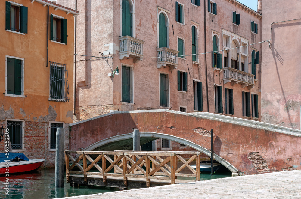 Small bridge over a canal in Venice Italy.
