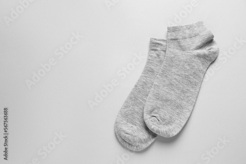 Pair of socks on light grey background, flat lay. Space for text © New Africa