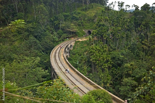 Nine Arches Bridge from above, Sri Lanka, Tourists walk on the famous Nine Arches Bridge at dawn, Ella, Sri Lanka. Aerial