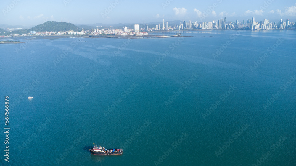 aerial photo from drone of Harbour with skylines of big Panama city on horizon
