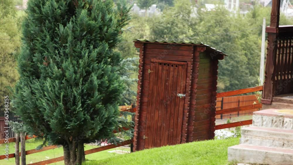 Rustic Brown Wood Outdoor Toilet On A Hillside. - Static Rustic Brown Wood Outdoor Toilet On A Hillside. - Static