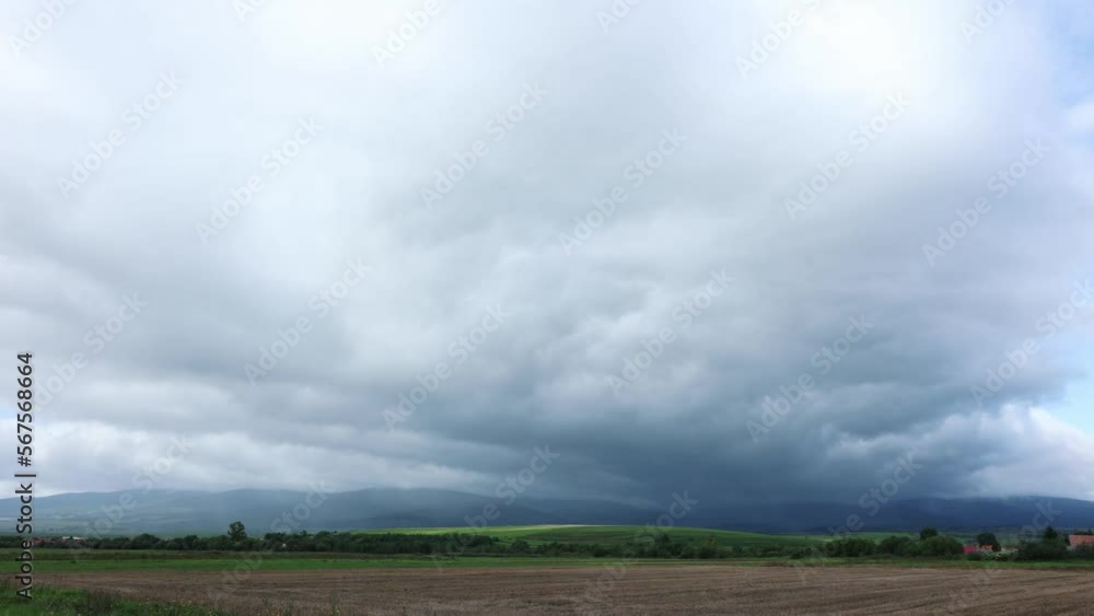 White Thick Clouds Moving Over The Vast Fields In The Countryside. - timelapse White Thick Clouds Moving Over The Vast Fields In The Countryside. - timelapse