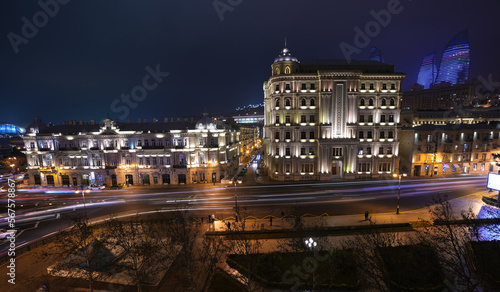 Long exposure photo in the roundabout cross from Azneft Square in Baku. Rush hour traffic night photo in Azerbaijan.