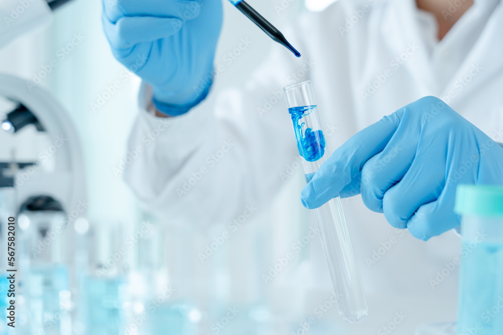 Scientist analyze biochemical samples in advanced scientific laboratory. Medical professional use dropper mix microbiological developmental of viral. Biotechnology research in  science lab. cosmetic