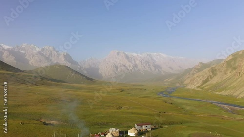 Revealing drone shot of a Yurt campsite near the Kurumduk river in Kyrgyzstan photo
