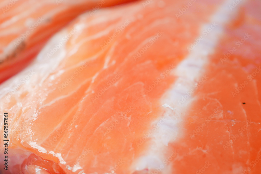 Raw, fresh salmon steak on a plastic packet on table Raw, fresh salmon steak on a plastic packet on table