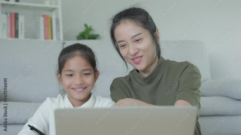 online tutor online course for Asian children. video conference on laptop at home. play back online course, girl student wear earphones to study, notes homework, video classes, new education. online tutor online course for Asian children. video conference on laptop at home. play back online course, girl student wear earphones to study, notes homework, video classes, new education.