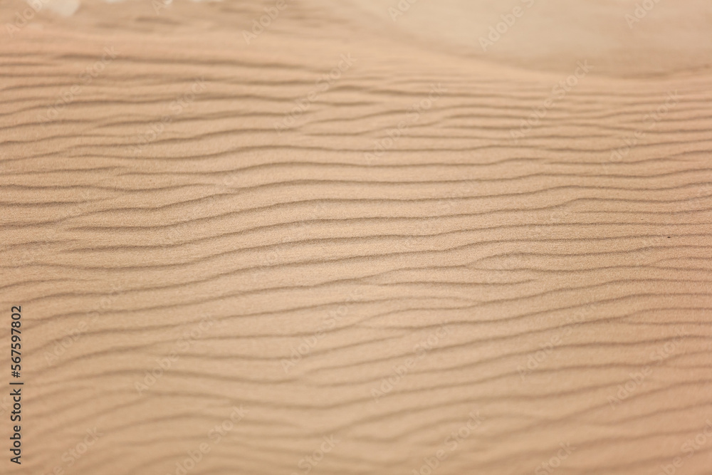 Top view of beautiful golden sand dunes with ripples in desert Top view of beautiful golden sand dunes with ripples in desert
