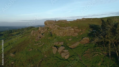 Forward Drone Shot Flying up towards Cow and Calf Rock Formation on Ilkley Moor West Yorkshire UK photo