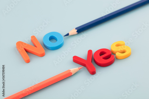 The colored pencil points to yes and no photo
