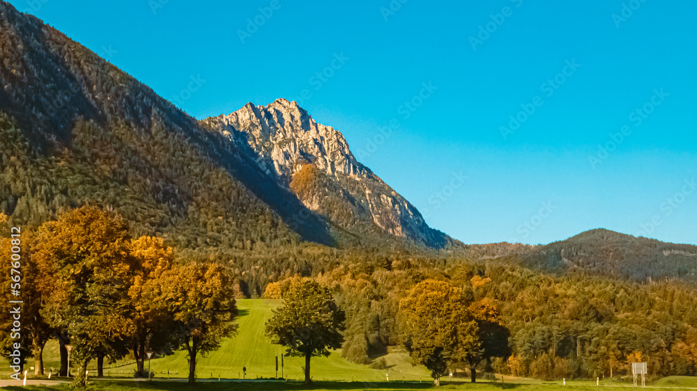 Beautiful autumn or indian summer view with the famous Hochstaufen summit in the background near Piding, Bavaria, Germany
