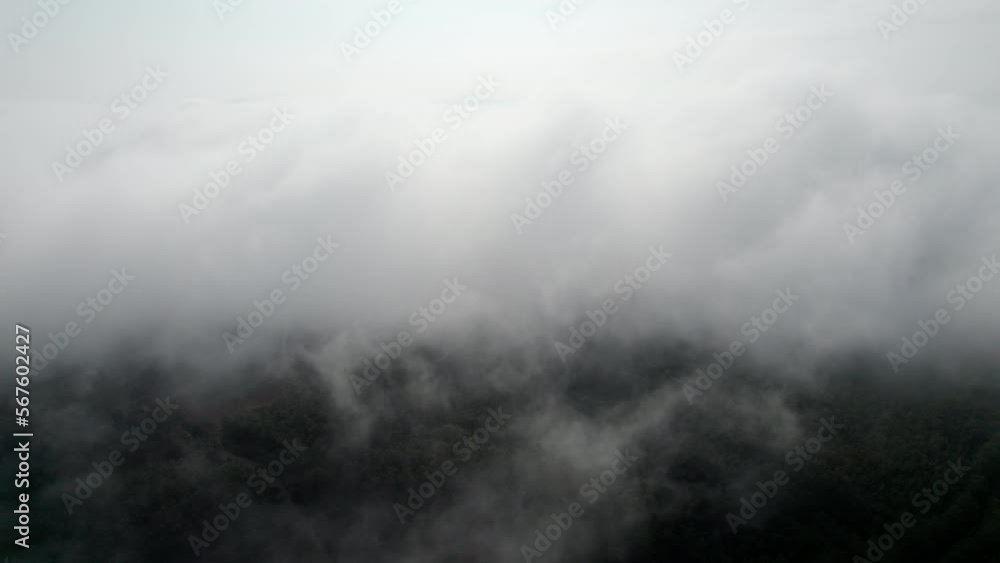 Top view Landscape of Morning Mist with Mountain Layer at north of Thailand. mountain ridge and clouds in rural jungle bush forest Top view Landscape of Morning Mist with Mountain Layer at north of Thailand. mountain ridge and clouds in rural jungle bush forest