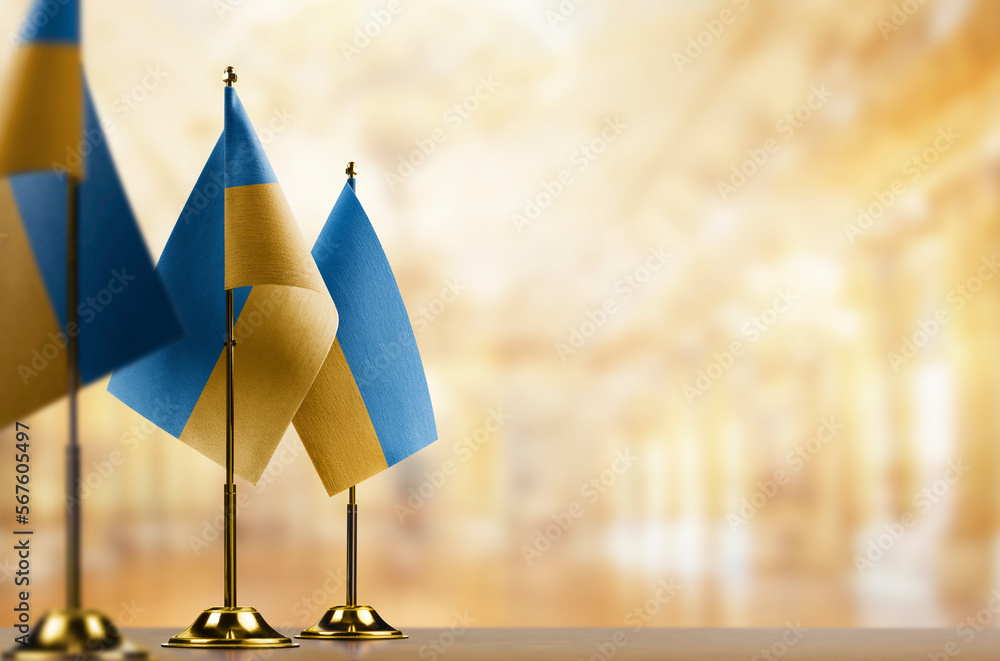 A small Ukraine flag on an abstract blurry background