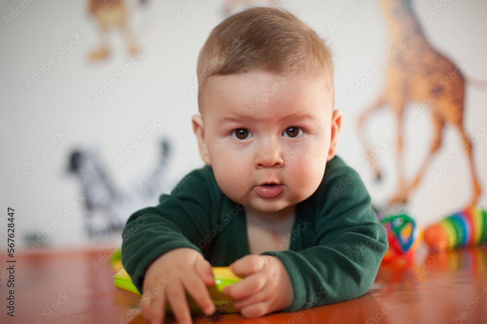 Portrait view of cute baby boy. Joy and happiness concept. Love and family emotion Portrait view of cute baby boy. Joy and happiness concept. Love and family emotion
