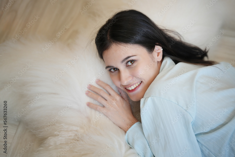 Cheerful woman playing with her dog in apartment. Cheerful woman playing with her dog in apartment.