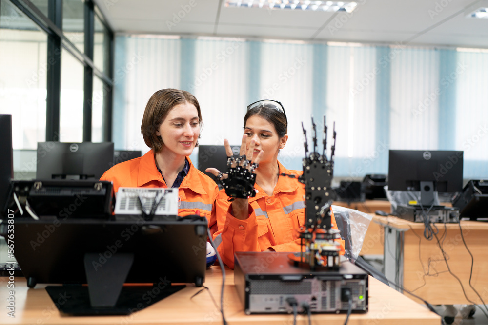 Fototapeta premium Engineer check and control welding robotics automatic arms machine in intelligent factory automotive industrial with monitoring system software. Digital manufacturing operation. Industry 4.0