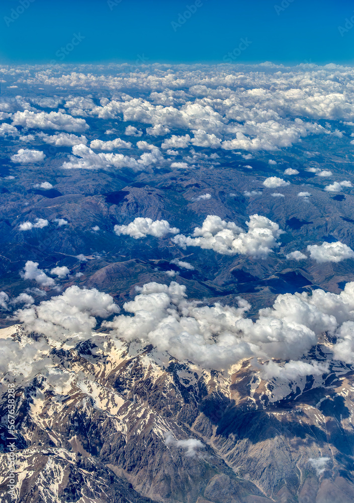 aerial view range of mountains with snowy peaks