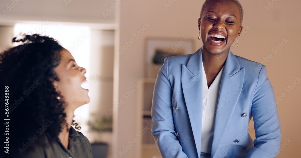 Funny, collaboration and success with a business woman team laughing in their office together at night. Teamwork, comic and startup with an employee and colleague joking while working in the office Funny, collaboration and success with a business woman team laughing in their office together at night. Teamwork, comic and startup with an employee and colleague joking while working in the office