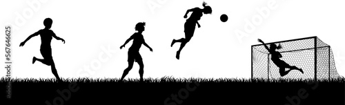 Women players footballers in silhouette scene playing a soccer or football match on a pitch