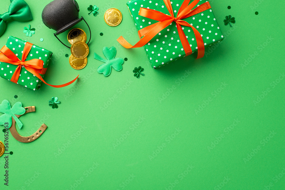 Saint Patrick's Day concept. Top view photo of green gift boxes with orange ribbon bows pot with gold coins horseshoe tie bow shamrocks and confetti on isolated green background with copyspace