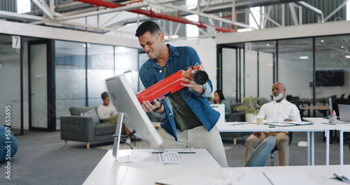 Anger, frustrated and fire extinguisher with a business man breaking a computer during a breakdown at work. Compliance, glitch and 404 with an angry male employee smashing a desktop in the office © K Davis/peopleimages.com