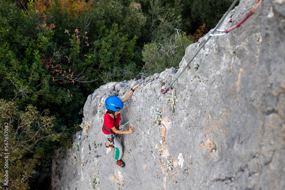 climber boy. the child trains in rock climbing. climber boy. the child trains in rock climbing.