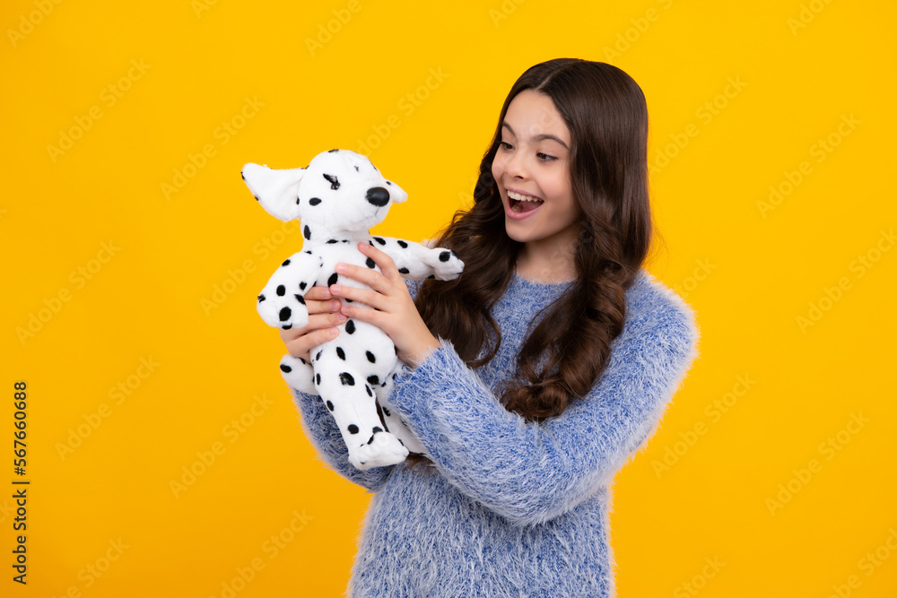 Funny teenage child hold toy. Happy childhood. Kid playing toy. Childcare concept. Happy teenager, positive and smiling emotions of teen girl. Funny teenage child hold toy. Happy childhood. Kid playing toy. Childcare concept. Happy teenager, positive and smiling emotions of teen girl.