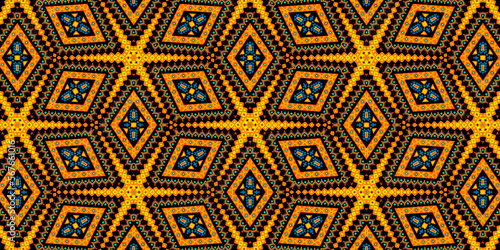 Abstracts suns. Geometric African pattern. Colored and seamless design. Golden yellow, orange, brown, blue an black colors. Illustration
