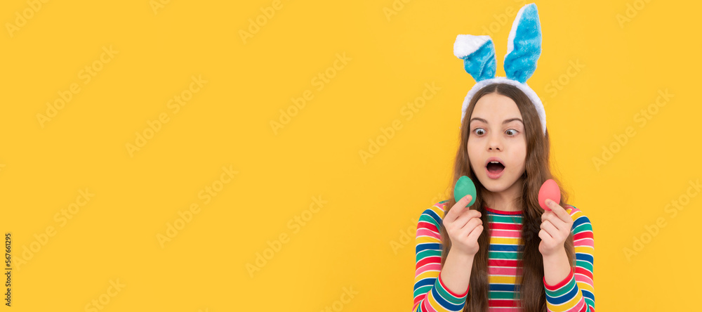 I feel shocked. child in rabbit ears hold painted eggs. time for fun. adorable funny kid on egg hunt. Easter child horizontal poster. Web banner header of bunny kid, copy space. I feel shocked. child in rabbit ears hold painted eggs. time for fun. adorable funny kid on egg hunt. Easter child horizontal poster. Web banner header of bunny kid, copy space.