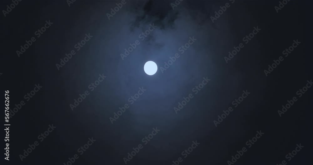 Moon and clouds in the night sky. Clouds float against the backdrop of ...