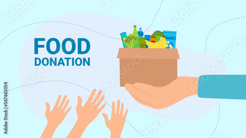 people giving a donation box with food for charity and solidarity.