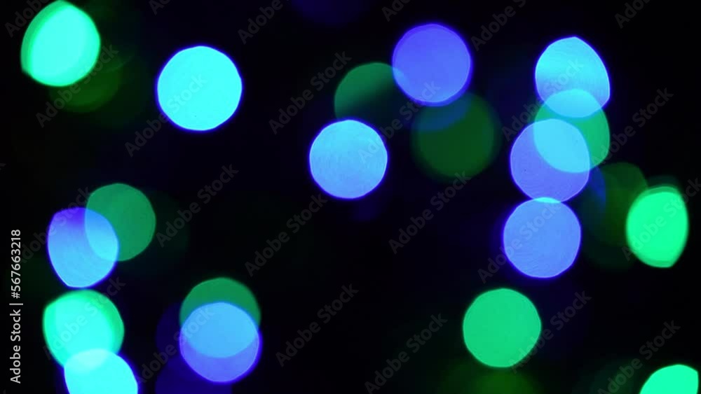 Realistic bokeh lights. Slow flashing Christmas garland lights. Defocus traditional decoration for Christmas trees and houses. Glowing blurred circles. Holiday background or overlay. Loop 4K footage. Realistic bokeh lights. Slow flashing Christmas garland lights. Defocus traditional decoration for Christmas trees and houses. Glowing blurred circles. Holiday background or overlay. Loop 4K footage.