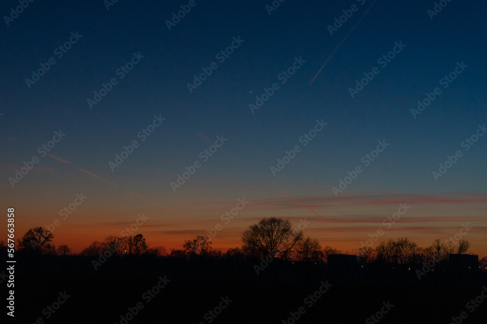 Sunset is a tranquil and beautiful moment, as the sun dips below the horizon and the sky lights up in a spectrum of colors. Sunset is a tranquil and beautiful moment, as the sun dips below the horizon and the sky lights up in a spectrum of colors.