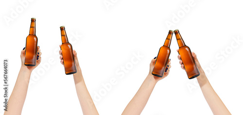 girls holding beer bottle in the air, file contains clipping path