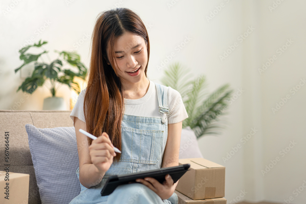 Young entrepreneur is using tablet to writing customer data and Young entrepreneur is using tablet to writing customer data and