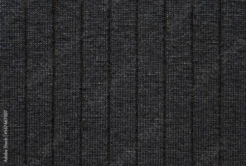 Soft black color ribbed jersey fabric pattern close up as background