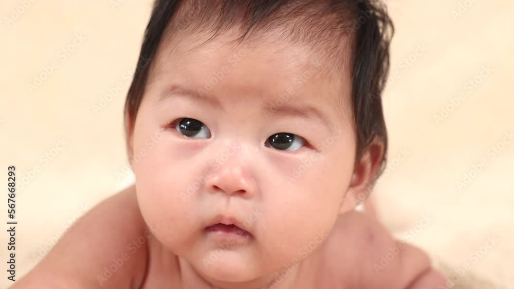 Closeup Asian newborn baby lying prone on beige soft bed. adorable infant without clothes looking for mom want to play with mother while she work, baby feel hungry want milk. healthy toddler.
Closeup Asian newborn baby lying prone on beige soft bed. adorable infant without clothes looking for mom want to play with mother while she work, baby feel hungry want milk. healthy toddler.