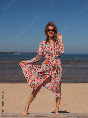 young slender woman by the sea