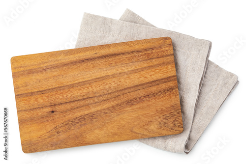 Wooden cutting board on linen napkin isolated on white background, top view photo