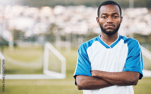 Sports, black man and portrait of soccer player on field, focus and motivation for winning game in Africa. Confident, proud face and serious mindset at professional football exercise training match.