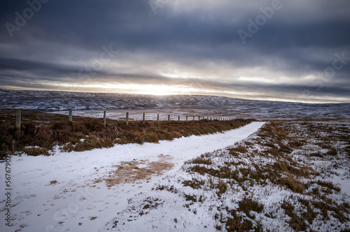 The frozen snow covered landscape  countryside of Buckshott moor with distant views of Muggleswick and Edmondbyers in winter near Blanchland  Northumberland  in England UK.