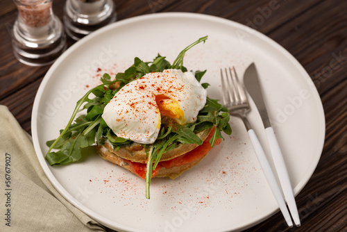 Squash waffles with poached egg, salmon and arugula